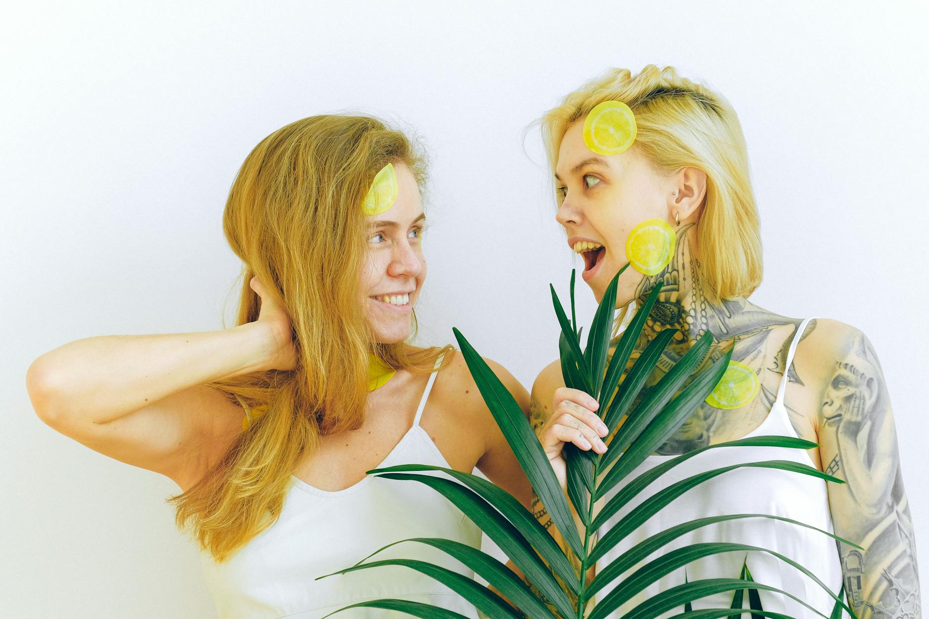 Two women smiling together, expressing joy and comfort during a conversation about body changes
